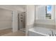 Bathroom with soaking tub and walk-in shower at 280 Umstead St, Sanford, NC 27330