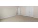 Simple bedroom with carpet flooring and neutral walls at 280 Umstead St, Sanford, NC 27330