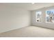 Well-lit bedroom with neutral walls and carpeted floors at 280 Umstead St, Sanford, NC 27330