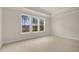 Spacious bedroom with neutral carpeting and large windows offering a view at 280 Umstead St, Sanford, NC 27330