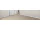 Spacious bedroom with neutral carpeting and access to other rooms at 280 Umstead St, Sanford, NC 27330