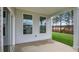 Covered patio with view of backyard and wooded area at 280 Umstead St, Sanford, NC 27330