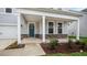 Covered porch with stone base and blue front door at 280 Umstead St, Sanford, NC 27330