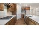 Bright kitchen boasts stylish cabinetry, gas cooktop, and a large island with seating at 280 Umstead St, Sanford, NC 27330