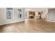 Open living space with hardwood floors, kitchen views, and a staircase at 280 Umstead St, Sanford, NC 27330