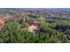 Aerial view of property showcasing expansive wooded acreage and structures at 3214 Tump Wilkins Rd, Stem, NC 27581