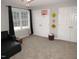 Spacious bedroom with double doors and a window offering natural light at 3214 Tump Wilkins Rd, Stem, NC 27581