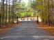 Iron gate entrance to the property at 3214 Tump Wilkins Rd, Stem, NC 27581