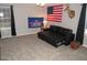 Living room with sofa and American flag at 3214 Tump Wilkins Rd, Stem, NC 27581