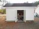 White storage shed with double doors open at 3214 Tump Wilkins Rd, Stem, NC 27581