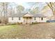 Ranch style home with a covered porch and landscaped yard at 370 Lakestone Estates Ests, Pittsboro, NC 27312