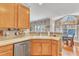 Modern kitchen with wood cabinets, stainless steel appliances, and a breakfast nook at 513 Woodson Dr, Clayton, NC 27527