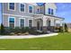 Two-story home with gray siding, stone accents, and a covered porch at 8740 Maxine St # 7 Selma, Willow Springs, NC 27592