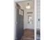 Bright entryway with a gray door, white trim, and hardwood floors at 8740 Maxine St # 7 Selma, Willow Springs, NC 27592