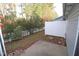 Private backyard with patio and white vinyl fence at 11331 Involute Pl # 100, Raleigh, NC 27617