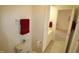 Simple bathroom with toilet, sink, and linen storage at 11331 Involute Pl # 100, Raleigh, NC 27617