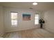 Spacious bedroom with hardwood floors and large windows at 11331 Involute Pl # 100, Raleigh, NC 27617