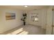 Bright and airy bedroom with a large window and laminate wood flooring at 11331 Involute Pl # 100, Raleigh, NC 27617