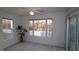 Relaxing living room with large windows and access to patio at 11331 Involute Pl # 100, Raleigh, NC 27617
