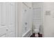 Clean bathroom features a shower/tub combo, toilet and wood-look flooring at 1204 Breedlove Rd, Nashville, NC 27856