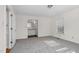 Spacious bedroom with grey carpet, large window, and access to bathroom at 1204 Breedlove Rd, Nashville, NC 27856