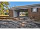 Brick carport with attached storage area and driveway at 1204 Breedlove Rd, Nashville, NC 27856