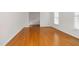 Hardwood floor dining room with large windows and chandelier at 1204 Breedlove Rd, Nashville, NC 27856