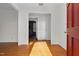 Bright entryway with hardwood floors and view into the living room at 1204 Breedlove Rd, Nashville, NC 27856