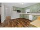 Eat-in kitchen, featuring light green cabinets and a view into another room at 1204 Breedlove Rd, Nashville, NC 27856