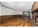 Open living room with a view of the kitchen and brick fireplace at 1204 Breedlove Rd, Nashville, NC 27856
