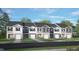 Five-unit townhome building, gray and white exterior, landscaping at 13 Sweet Meadow Rd, Angier, NC 27501