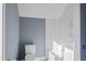 Clean bathroom with white subway tile, a white bathtub and blue walls at 154 Leatherwood Ln, Chapel Hill, NC 27517
