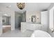 Bathroom with a walk-in shower, free-standing tub, and modern vanity at 154 Leatherwood Ln, Chapel Hill, NC 27517