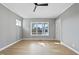 Bright bedroom with hardwood floors and large windows with wooded views at 154 Leatherwood Ln, Chapel Hill, NC 27517