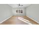 Bright bedroom with hardwood floors and a large window offering natural light at 154 Leatherwood Ln, Chapel Hill, NC 27517