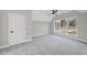 Well-lit bedroom with gray carpeting and large window at 154 Leatherwood Ln, Chapel Hill, NC 27517