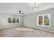 Spacious bedroom with hardwood floors and large windows at 154 Leatherwood Ln, Chapel Hill, NC 27517