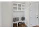 White built-in bench with cubbies and a cute decorative touch at 154 Leatherwood Ln, Chapel Hill, NC 27517
