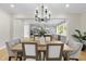 Bright dining room with chandelier and hardwood floors at 154 Leatherwood Ln, Chapel Hill, NC 27517