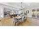 Elegant dining room with a large wooden table and access to the kitchen at 154 Leatherwood Ln, Chapel Hill, NC 27517