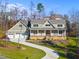 Two-story house with a three-car garage and a long driveway at 154 Leatherwood Ln, Chapel Hill, NC 27517