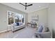 Bright home office features hardwood floors, large windows, and comfortable seating at 154 Leatherwood Ln, Chapel Hill, NC 27517