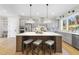 Modern kitchen with large island, stainless steel appliances, and ample counter space at 154 Leatherwood Ln, Chapel Hill, NC 27517