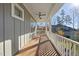 Spacious porch with wooden flooring and white railings at 154 Leatherwood Ln, Chapel Hill, NC 27517