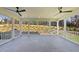 Spacious screened porch with ceiling fans and wooded views at 154 Leatherwood Ln, Chapel Hill, NC 27517