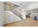 Elegant staircase with wooden handrail and black metal balusters at 154 Leatherwood Ln, Chapel Hill, NC 27517