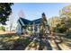 Green house with a black roof, chimney, and a partially visible front porch at 248 Southgate Dr, Garner, NC 27529