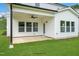 Covered patio with ceiling fan and access to backyard at 8749 Maxine St # 11 Holly, Willow Springs, NC 27592