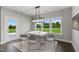 Bright dining room with access to backyard and large windows at 8749 Maxine St # 11 Holly, Willow Springs, NC 27592