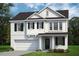 Two-story home with white siding, black windows, and a two-car garage at 8749 Maxine St # 11 Holly, Willow Springs, NC 27592